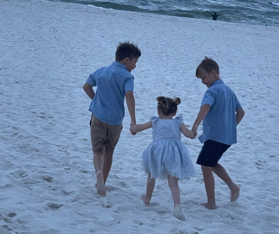 kids running on the beach