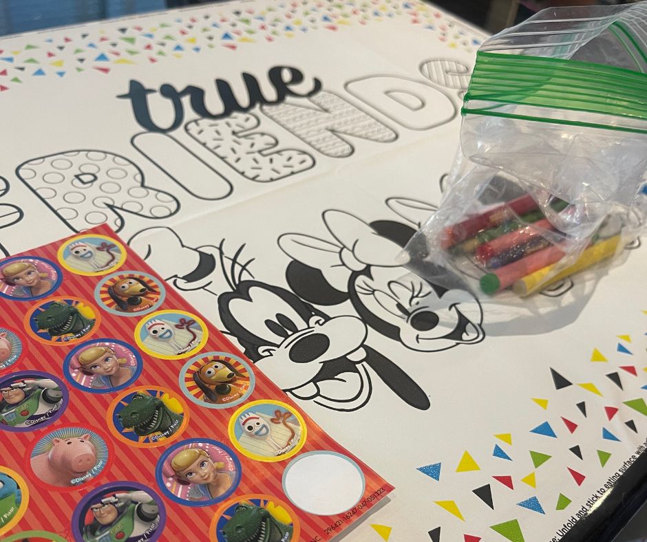 stickers, crayons and a coloring mat